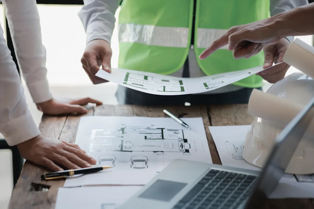 Crown Building team reviewing drawings and contract pricing, London