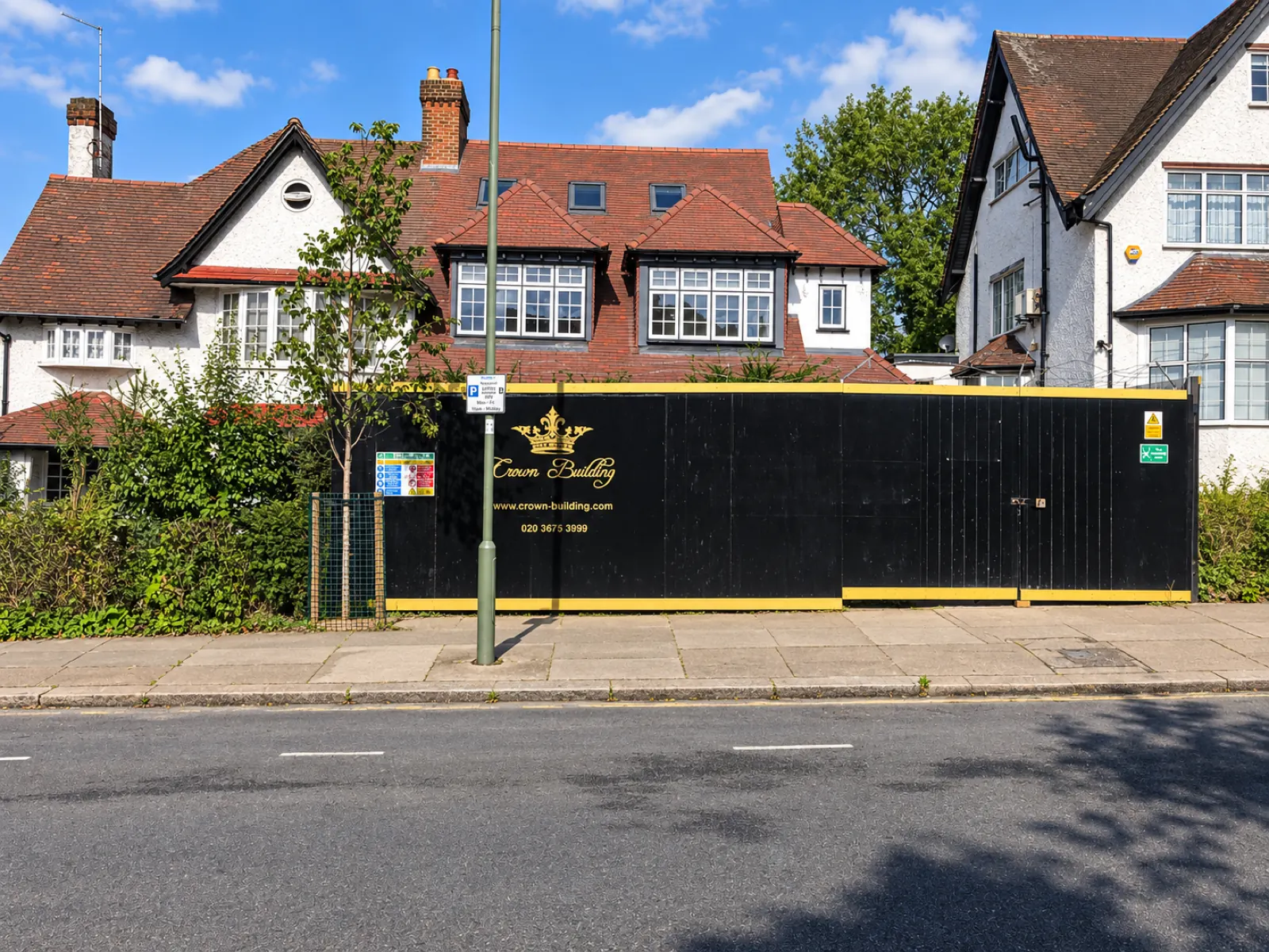 Period house in Golders Green behind Crown Building site hoarding, front facade retained