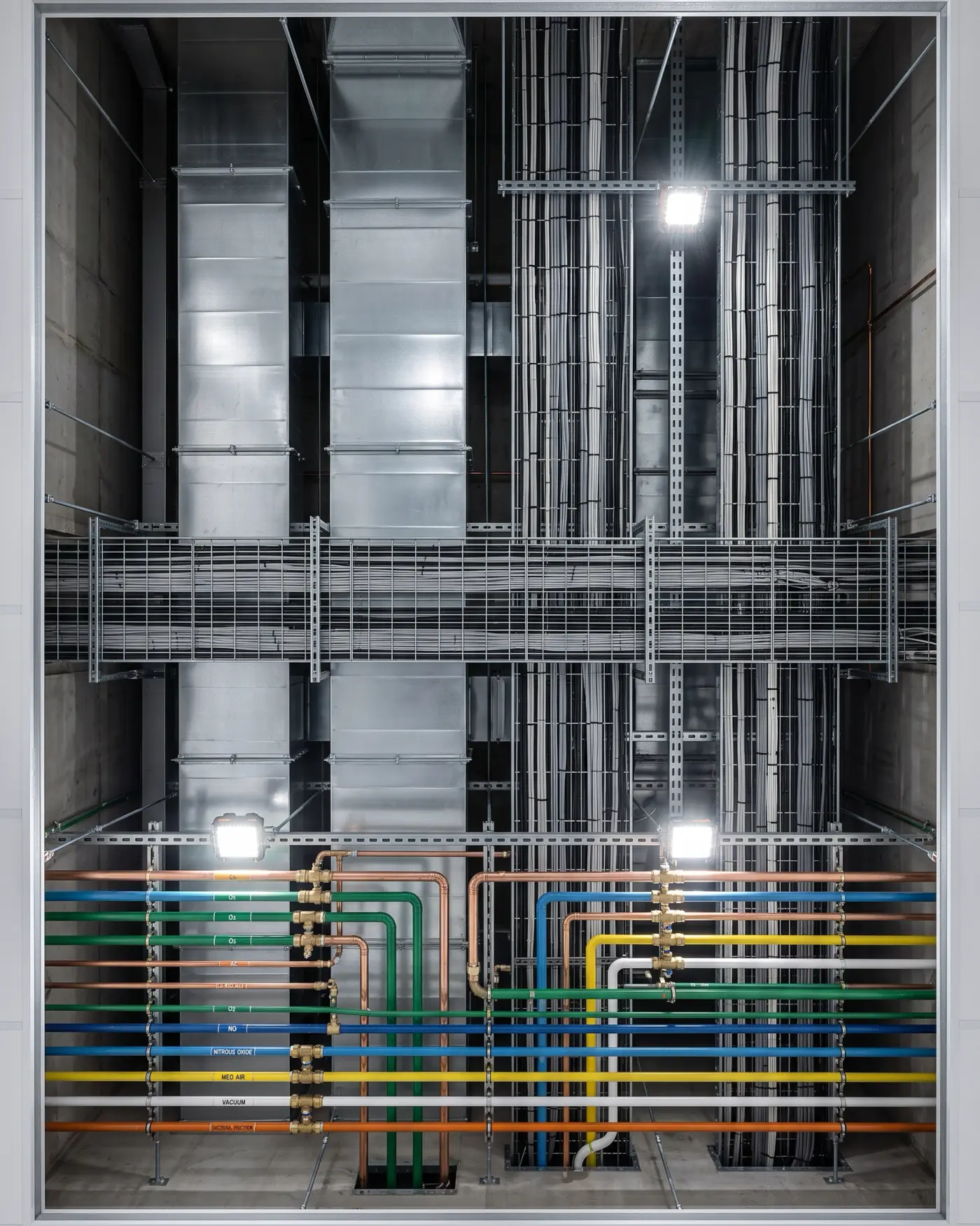 Segregated and colour coded mechanical and electrical services in a clinical riser